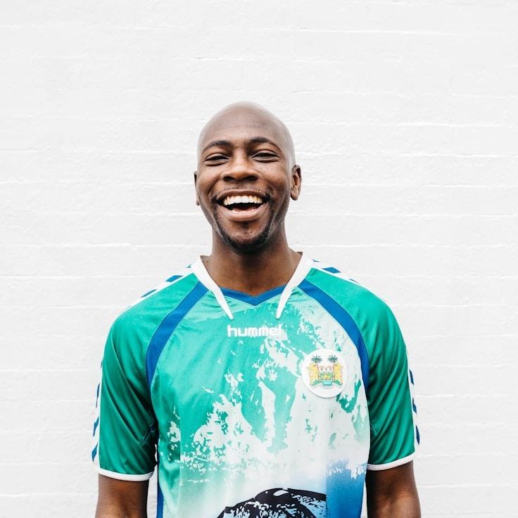 A generic lead designer reviewing corporate floral arrangements